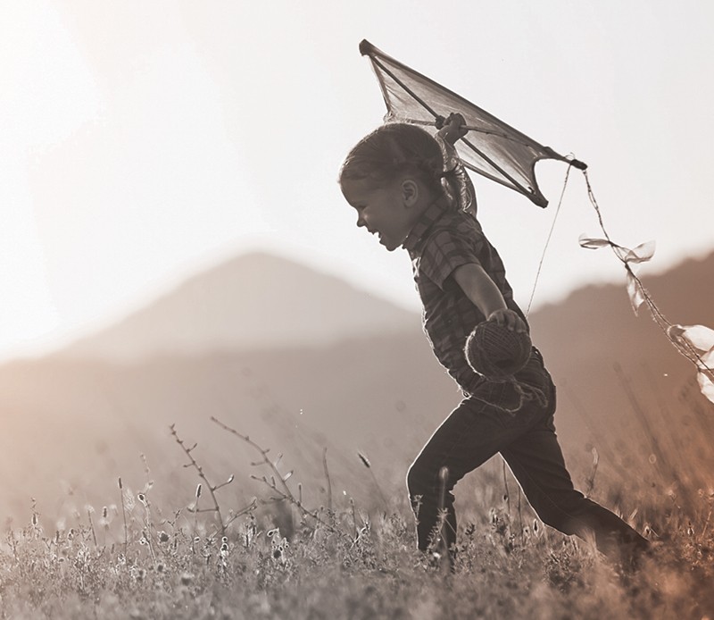 A child holding a kite